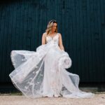 Bride in hand-pianted Savin Wedding Dress at Silchester Farm